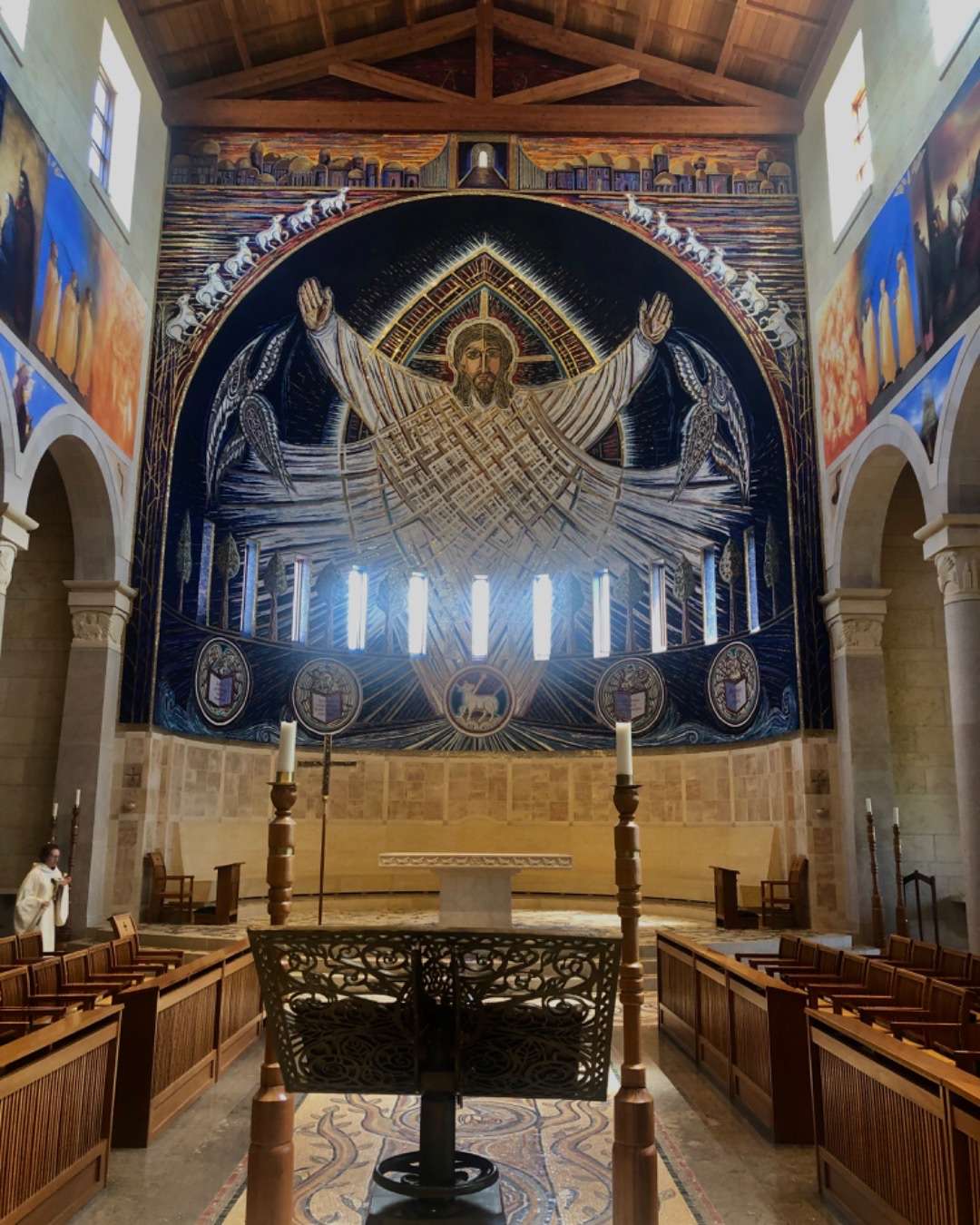 Painting of Jesus with arms outstretched in church altar